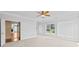 Bright bedroom with neutral carpet and paint, natural light, and view of an opening to another living space at 112 Doyle Farm Ln, Mooresville, NC 28115