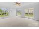 Bedroom with carpet, lots of natural light, white trim and crown molding. Three large windows at 112 Doyle Farm Ln, Mooresville, NC 28115