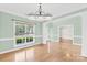 Spacious dining room features hardwood floors, white trim, natural light and views of the surrounding area at 112 Doyle Farm Ln, Mooresville, NC 28115