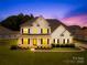 Charming two-story home with well-manicured lawn and inviting front porch at 112 Doyle Farm Ln, Mooresville, NC 28115