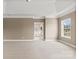 Large main bedroom with neutral carpet, tray ceiling, a window, and ensuite bathroom at 112 Doyle Farm Ln, Mooresville, NC 28115