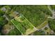 Expansive lot with mature trees, outlined in white, offers privacy and natural beauty at 11201 Johnson Davis Rd, Huntersville, NC 28078