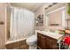 Bathroom featuring a shower and tub combination, a toilet, and a vanity at 11201 Johnson Davis Rd, Huntersville, NC 28078