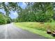 View of land and trees lining the road at 11201 Johnson Davis Rd, Huntersville, NC 28078