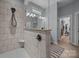 Modern bathroom features a walk-in shower, neutral color palette, and walk-in closet at 11329 Fullerton Place Nw Dr, Huntersville, NC 28078