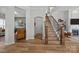 Welcoming foyer with hardwood floors, staircase, and access to living spaces at 11329 Fullerton Place Nw Dr, Huntersville, NC 28078