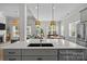 Modern kitchen with a large island, stainless steel appliances, and open layout at 11329 Fullerton Place Nw Dr, Huntersville, NC 28078