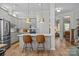 Modern kitchen with stainless steel appliances, gray cabinetry, and center island seating at 11329 Fullerton Place Nw Dr, Huntersville, NC 28078