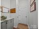 Practical mud room with storage cabinets, drop box, and easy access to the garage at 11329 Fullerton Place Nw Dr, Huntersville, NC 28078