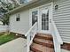 Back of the house with a set of doors that lead to a backyard at 120 Todd Nw Dr, Concord, NC 28025