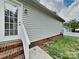 Back of the house with a set of doors that lead to a backyard at 120 Todd Nw Dr, Concord, NC 28025