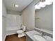 Bathroom with gray vanity, stone countertops, and a shower and tub combo at 120 Todd Nw Dr, Concord, NC 28025