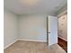 Bedroom with neutral walls, carpet, and a closet door leading to the utility room at 120 Todd Nw Dr, Concord, NC 28025