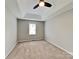 Comfortable carpeted bedroom with neutral walls and a tray ceiling providing a relaxing retreat at 120 Todd Nw Dr, Concord, NC 28025