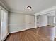 Dining room area with a window letting in natural light and new vinyl floors throughout at 120 Todd Nw Dr, Concord, NC 28025