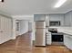 Modern kitchen featuring stainless steel appliances, granite countertops, subway tile backsplash, and gray painted cabinetry at 120 Todd Nw Dr, Concord, NC 28025