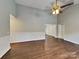 Inviting living room with vaulted ceilings, a ceiling fan, and wood-look flooring providing an open and airy space at 120 Todd Nw Dr, Concord, NC 28025