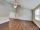 Inviting living room with vaulted ceilings, a ceiling fan, and wood-look flooring providing an open and airy space at 120 Todd Nw Dr, Concord, NC 28025