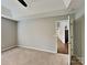 Neutral carpeted main bedroom with high ceilings and attached ensuite bathroom at 120 Todd Nw Dr, Concord, NC 28025