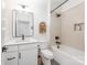 A modern bathroom features a vanity, and a shower-tub combination with tile and black fixtures at 1207 E 36Th St, Charlotte, NC 28205