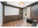 Stylish bonus room with hardwood floors, dark accent wall and potential for a theater at 1207 E 36Th St, Charlotte, NC 28205