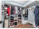 A walk-in closet offers plenty of storage with built-in shelving and hanging rods for organization at 1207 E 36Th St, Charlotte, NC 28205