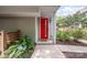 Inviting front entrance featuring a vibrant red door and neat landscaping at 1207 E 36Th St, Charlotte, NC 28205