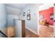 Upstairs hallway showcasing beautiful wood floors and light blue walls at 1207 E 36Th St, Charlotte, NC 28205