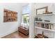 Inviting nook with pillows, window, shelf with books and artwork at 1207 E 36Th St, Charlotte, NC 28205