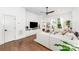 Cozy living room features hardwood floors, a ceiling fan and ample natural light at 1207 E 36Th St, Charlotte, NC 28205