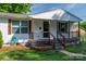 Charming covered porch with a decorated front door and visible house number at 1212 Frank Ext, Rock Hill, SC 29730