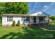 Quaint single story home with a welcoming covered front porch and tidy landscaping at 1212 Frank Ext, Rock Hill, SC 29730