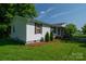 Side view of a cozy home highlighting the front porch and neat landscaping at 1212 Frank Ext, Rock Hill, SC 29730