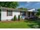 Traditional single story home showcasing a well manicured lawn and cozy front porch at 1212 Frank Ext, Rock Hill, SC 29730