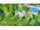 Aerial view showing playground surrounded by lush trees, part of a community's recreational amenities at 12304 Huntersville Concord Rd, Huntersville, NC 28078