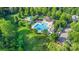 Aerial view of community amenities, featuring a large pool, playground, and well-maintained green spaces at 12304 Huntersville Concord Rd, Huntersville, NC 28078