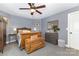 Comfortable bedroom featuring a ceiling fan, and soft carpet at 12304 Huntersville Concord Rd, Huntersville, NC 28078