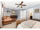 Comfortable bedroom featuring a sitting area, soft carpet, and a ceiling fan at 12304 Huntersville Concord Rd, Huntersville, NC 28078