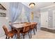 Dining room featuring a wooden table with seating for eight, light-filled room with neutral walls at 12304 Huntersville Concord Rd, Huntersville, NC 28078