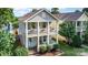 Charming two-story home with double front porches, bright blue door, and well-maintained lawn at 12304 Huntersville Concord Rd, Huntersville, NC 28078