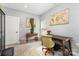 Bright home office with a large desk, neutral walls, and natural light at 12304 Huntersville Concord Rd, Huntersville, NC 28078