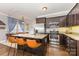 Modern kitchen featuring granite countertops, stainless steel appliances, and a spacious island with bar seating at 12304 Huntersville Concord Rd, Huntersville, NC 28078