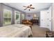 Main bedroom with natural light, wooden dresser, and neutral carpet at 12304 Huntersville Concord Rd, Huntersville, NC 28078