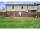 Backyard featuring a small brick privacy fence and grass area at 1330 5Th Ne St, Hickory, NC 28601
