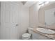 Half bathroom featuring a toilet, vanity with sink, mirror, and storage at 1330 5Th Ne St, Hickory, NC 28601