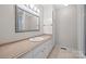 Bathroom featuring a vanity with a built in sink, large mirror and modern lighting at 1330 5Th Ne St, Hickory, NC 28601