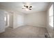 Bedroom featuring neutral colored carpet, white trim, ceiling fan and closet at 1330 5Th Ne St, Hickory, NC 28601