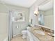 Well-lit bathroom showcasing granite counters, vanity, and a shower/tub with curtain at 13617 Lake Bluff Dr, Matthews, NC 28105