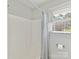 This bathroom has a shower/tub and a window letting in natural light at 13617 Lake Bluff Dr, Matthews, NC 28105
