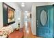 Inviting entryway with hardwood floors, an elegant door, and stylish decor creates a warm welcome at 13617 Lake Bluff Dr, Matthews, NC 28105